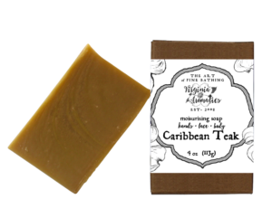 A scrumptious bar of handmade soap alongside its recycled-fiber kraft box.