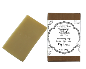 A scrumptious bar of handmade soap alongside its recycled-fiber kraft box.