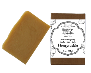 A scrumptious bar of handmade soap alongside its recycled-fiber kraft box.