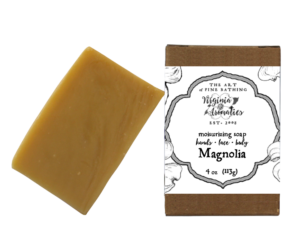 A scrumptious bar of handmade soap alongside its recycled-fiber kraft box.