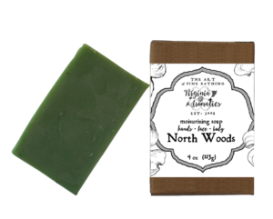 A scrumptious bar of handmade soap alongside its recycled-fiber kraft box.