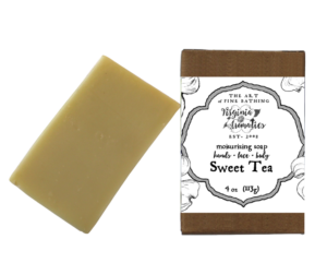 A scrumptious bar of handmade soap alongside its recycled-fiber kraft box.